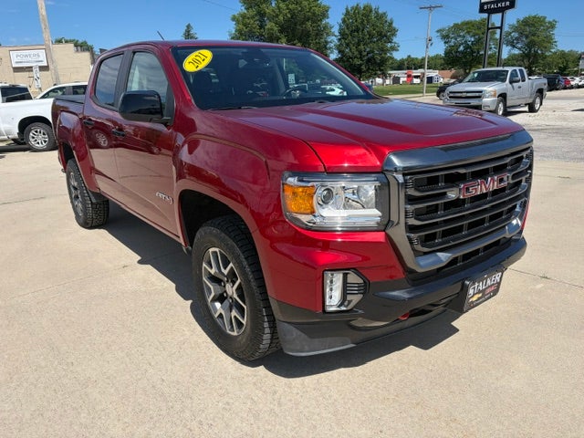 2021 GMC Canyon 4WD AT4 w/Leather in Cayenne Red Tintcoat — front three-quarter view